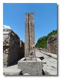 2011 05 12 Pompeii - fountain and water column with face of panther on Via del Vesuvia